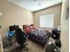 Comfortable bedroom with a large window at 2014 N 93Rd Dr, Phoenix, AZ 85037