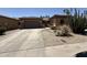 Charming single-Gathering home featuring a well-manicured front yard with xeriscape and a two-car garage at 2014 N 93Rd Dr, Phoenix, AZ 85037