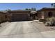 Charming single-Gathering home featuring a well-manicured front yard with xeriscape and a two-car garage at 2014 N 93Rd Dr, Phoenix, AZ 85037