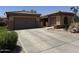 Charming single-Gathering home featuring a well-manicured front yard with xeriscape and a two-car garage at 2014 N 93Rd Dr, Phoenix, AZ 85037