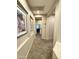 Hallway with carpet and artwork at 2014 N 93Rd Dr, Phoenix, AZ 85037