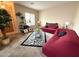 Inviting living room with comfortable seating, stylish decor, and a vibrant zebra print rug at 2014 N 93Rd Dr, Phoenix, AZ 85037