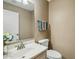Neutral half bathroom featuring a large mirror and a white toilet at 2061 E Flintlock Way, Chandler, AZ 85286
