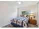 Comfortable bedroom with a wooden bed frame and soft, inviting bedding at 2061 E Flintlock Way, Chandler, AZ 85286