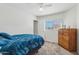 Bedroom with natural light, light walls, and carpet flooring at 2061 E Flintlock Way, Chandler, AZ 85286