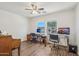 Versatile bedroom with dual desks, ample natural light, and modern ceiling fan, perfect for a home office at 2061 E Flintlock Way, Chandler, AZ 85286