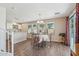 Cozy dining area adjacent to the kitchen with natural light, wood floors, and sliding door access to the outdoors at 2061 E Flintlock Way, Chandler, AZ 85286