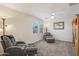 Cozy living room with plush seating and natural light from windows at 2061 E Flintlock Way, Chandler, AZ 85286