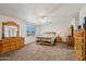Spacious bedroom with a ceiling fan and an exterior view from the window at 2061 E Flintlock Way, Chandler, AZ 85286