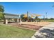 Community playground with covered seating and modern play structures at 2061 E Flintlock Way, Chandler, AZ 85286