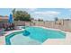 Inviting backyard pool with Baja step, adjacent patio and privacy wall at 2061 E Flintlock Way, Chandler, AZ 85286