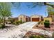 Beautiful home featuring a tile roof, well-maintained landscaping, and a spacious driveway leading to a two-car garage at 20962 W Thomas Rd, Buckeye, AZ 85396
