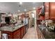 Well-equipped kitchen featuring stainless steel appliances, generous counter space, a convenient center island, and pantry access at 20962 W Thomas Rd, Buckeye, AZ 85396