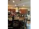 A gourmet kitchen showcasing a large island, granite countertops, stainless steel appliances, and a stylish backsplash at 20962 W Thomas Rd, Buckeye, AZ 85396