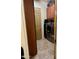 Convenient laundry room with front loading washer and dryer, extra storage, and easy access to the door at 20962 W Thomas Rd, Buckeye, AZ 85396