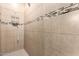 Tiled shower stall with modern fixtures, providing a clean and functional space at 20962 W Thomas Rd, Buckeye, AZ 85396