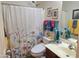Cozy bathroom with floral shower curtain, colorful towels, and coordinated decor for a refreshing space at 2101 S Meridian Rd # 199, Apache Junction, AZ 85120