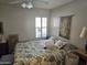 Comfortable bedroom with bright window, neutral walls, and decorative bedding for a peaceful retreat at 2101 S Meridian Rd # 199, Apache Junction, AZ 85120