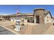 Inviting single Gathering house featuring a unique stone entrance, front patio, and desert landscaping at 2101 S Meridian Rd # 199, Apache Junction, AZ 85120