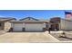 Charming home featuring a spacious two-car garage, desert landscaping, and an inviting entrance at 2101 S Meridian Rd # 199, Apache Junction, AZ 85120