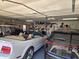 Neat garage showcasing multiple vehicles and organized storage solutions, ideal for car enthusiasts at 2101 S Meridian Rd # 199, Apache Junction, AZ 85120