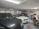 Spacious garage with multiple vehicles, ample storage, and functional organization at 2101 S Meridian Rd # 199, Apache Junction, AZ 85120