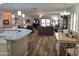 Spacious living room with hardwood floors, a ceiling fan, comfortable seating, and lots of sunlight at 2101 S Meridian Rd # 199, Apache Junction, AZ 85120