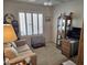 Inviting living room featuring a comfortable couch, bright window, and a cozy, relaxing ambiance at 2101 S Meridian Rd # 199, Apache Junction, AZ 85120