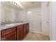 Main bathroom features granite countertops, modern cabinets, and a glass-enclosed shower at 23162 W Lasso Ln, Buckeye, AZ 85326