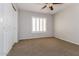 Neutral bedroom with carpet, ceiling fan, and window shutters offers a cozy and relaxing space at 23162 W Lasso Ln, Buckeye, AZ 85326