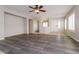 Spacious living room features wood-look floors, neutral paint, and ample natural light at 23162 W Lasso Ln, Buckeye, AZ 85326