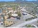 Expansive aerial view of a home with large lot, detached garage, and mountain views at 2627 W Buckskin Trl, New River, AZ 85087