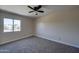 Bright bedroom with carpet and window with outdoor view at 2627 W Buckskin Trl, New River, AZ 85087