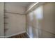 Walk-in closet with wood shelves and light wood flooring at 2627 W Buckskin Trl, New River, AZ 85087