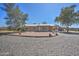 Charming ranch home features metal roof, gravel yard, and covered parking at 2627 W Buckskin Trl, New River, AZ 85087