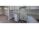 Kitchen with white cabinets and countertops at 2627 W Buckskin Trl, New River, AZ 85087