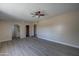 Spacious living room with new flooring and views of the adjoined bathroom at 2627 W Buckskin Trl, New River, AZ 85087