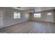 Bright living room featuring new floors, neutral paint, and plenty of natural light at 2627 W Buckskin Trl, New River, AZ 85087