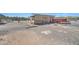 Shed featuring a garage and a gravel driveway at 2627 W Buckskin Trl, New River, AZ 85087
