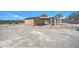 View of a shed with partial fencing and barren landscape at 2627 W Buckskin Trl, New River, AZ 85087