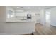 Modern kitchen featuring white cabinets, quartz countertops, and stainless steel appliances at 2728 W Redfield Rd, Phoenix, AZ 85053