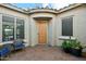 Inviting courtyard featuring a seating area, potted plants, and a charming entrance at 27308 N 56Th Dr, Phoenix, AZ 85083