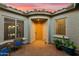 Charming courtyard featuring a cozy seating area and a view into the home's interior at 27308 N 56Th Dr, Phoenix, AZ 85083