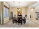 Bright dining room with a round table, fireplace, and large window at 27308 N 56Th Dr, Phoenix, AZ 85083