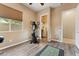 A multipurpose room features a wood look floor, exercise bike and separate craft room at 27308 N 56Th Dr, Phoenix, AZ 85083