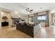 Spacious living room with fireplace, plush seating, and large windows at 27308 N 56Th Dr, Phoenix, AZ 85083