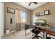 Cozy home office featuring a window, carpet and built-in shelving at 27308 N 56Th Dr, Phoenix, AZ 85083