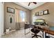 Office features a desk, fish tank, shelving and neutral tones at 27308 N 56Th Dr, Phoenix, AZ 85083