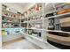 Spacious walk-in pantry with organized shelving and ample storage for all your kitchen needs at 27308 N 56Th Dr, Phoenix, AZ 85083