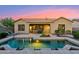 Gorgeous backyard pool, patio, and desert landscaping create a peaceful retreat at 27308 N 56Th Dr, Phoenix, AZ 85083